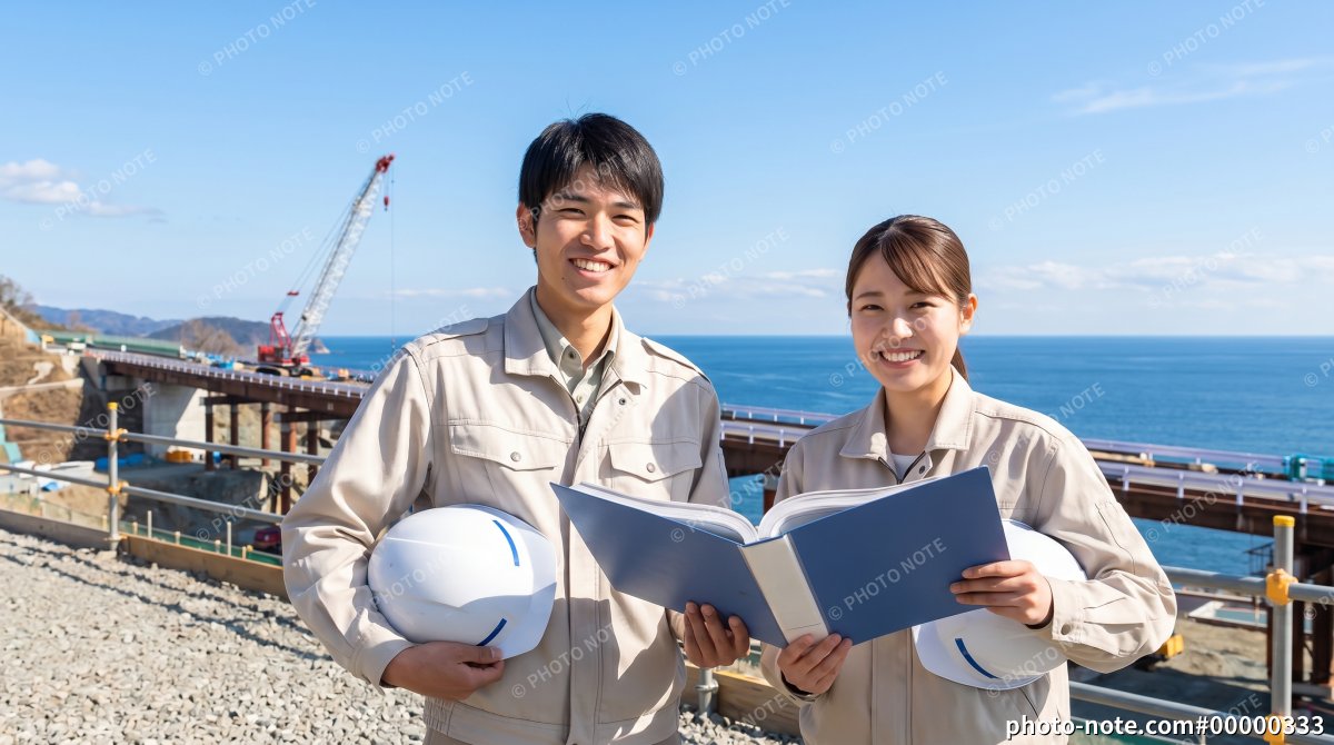 海岸沿いのインフラ・橋梁工事現場で働く施工管理の男女