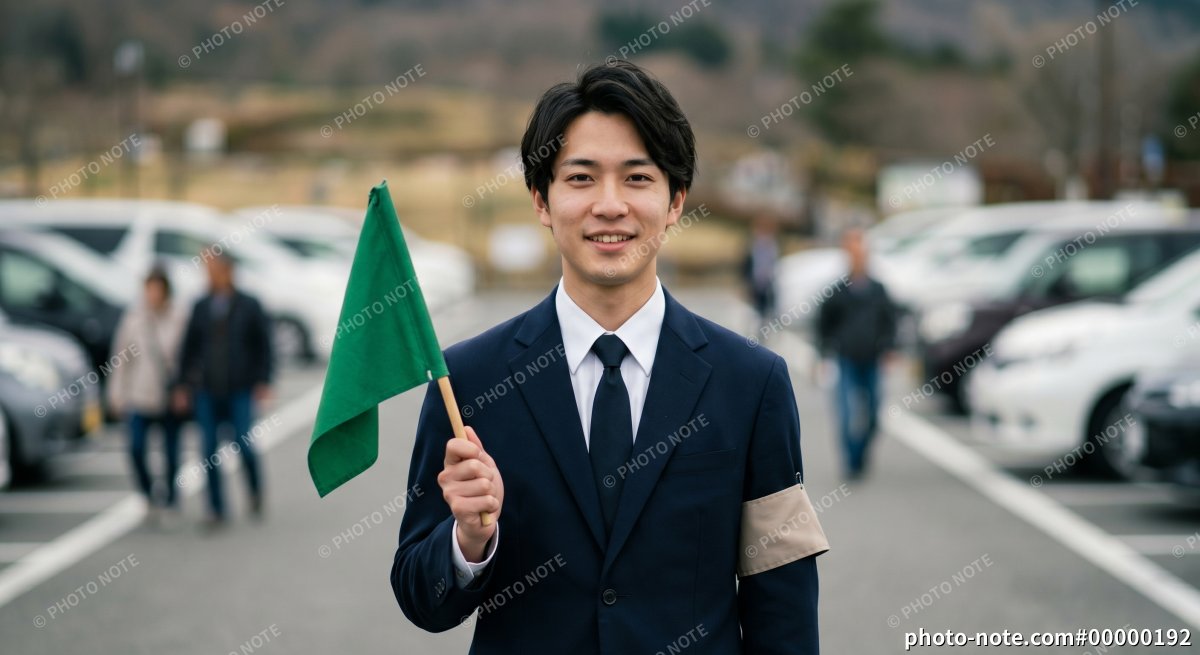 旗を持つ添乗員・ツアーコンダクダーの男性