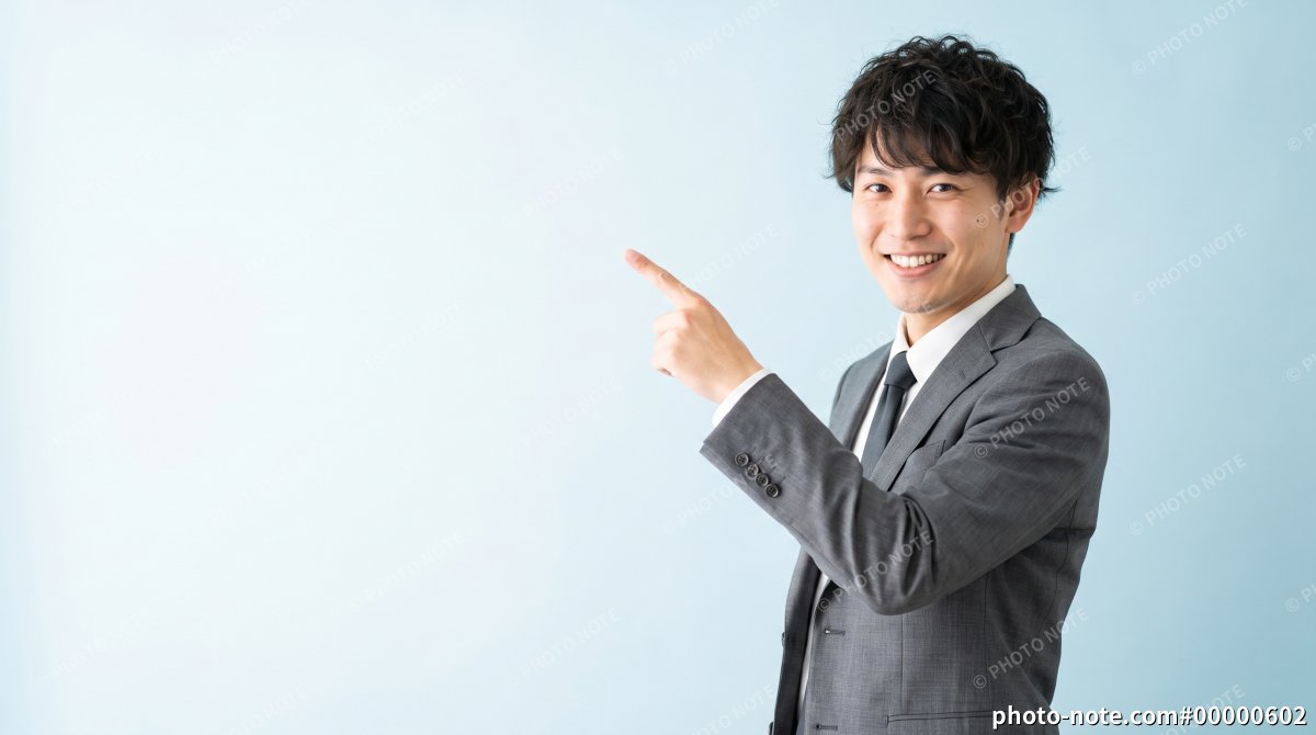 おすすめや案内を示すスーツ姿の若い男性のビジネスイメージ